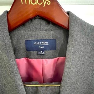Never worn two piece Jones Wear Grey pants suit with pink liner